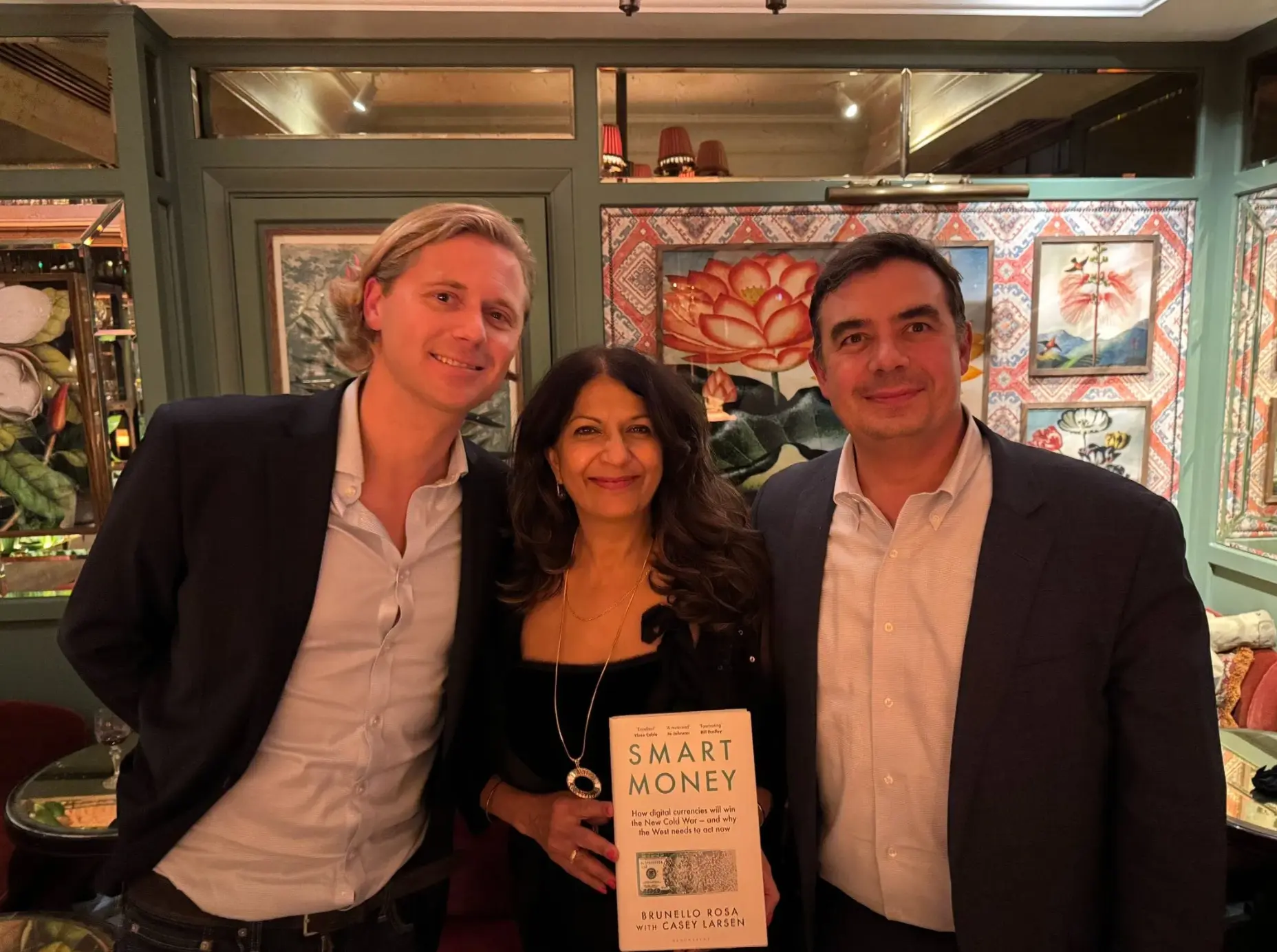 Casey Thomas Larsen at the House of Block book launch with a copy of Smart Money, October 2024